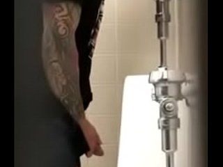 Handsome tatooed man pissing https://nakedguyz.blogspot.com